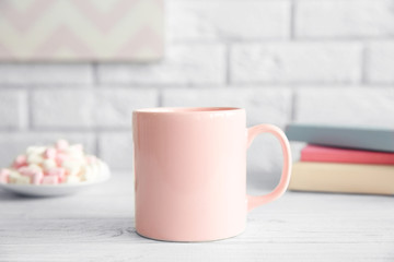 Blank cup on white table