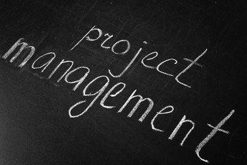 Fototapeta premium Phrase Project Management written on blackboard