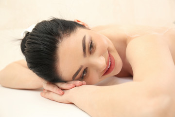 Obraz premium Beautiful young woman in spa salon