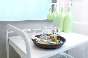 Set of essential oils in modern spa salon