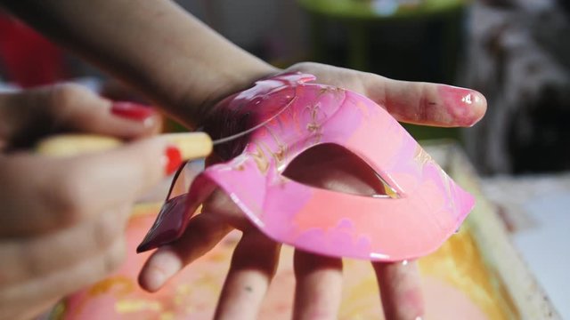 Liquid Ebru art technics - the woman shows created carnival masque