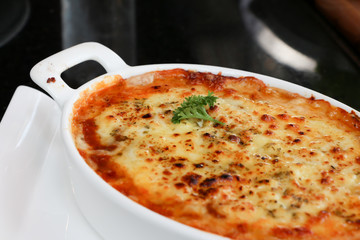Lasagna on black table 