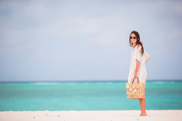 Fototapeta na wymiar Young beautiful woman during tropical beach vacation