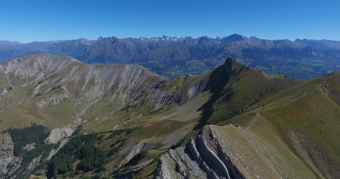 Aerial scenic mountain fly over ridge