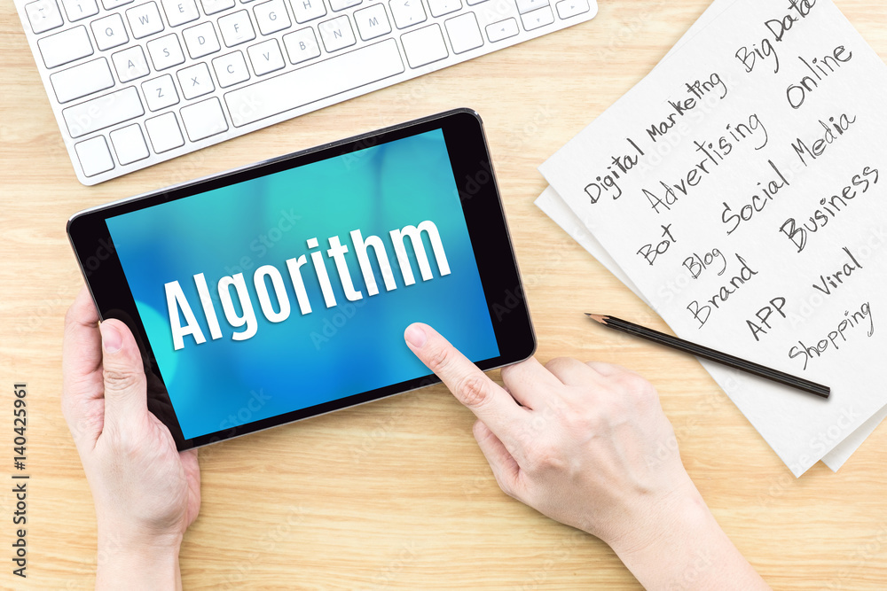 Poster Hand using tablet with Algorithm word on screen with list of digital marketing features on paper on work table,Online business concept