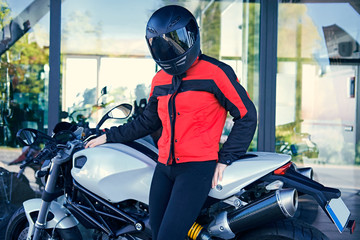 Plakat A woman posing with white speed motorcycle.