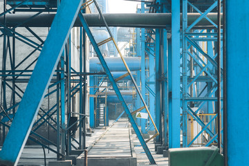 steel pipelines and cables in a plant,Industrial zone.