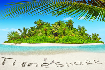 Whole tropical island within atoll in tropical Ocean and inscription 