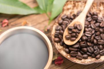 Wooden cup of coffee on wooden table