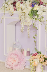 Fireplace decorated with flowers.