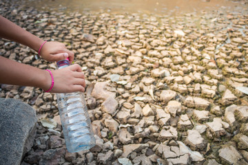 Children pour water on the arid ground, Drought concept.