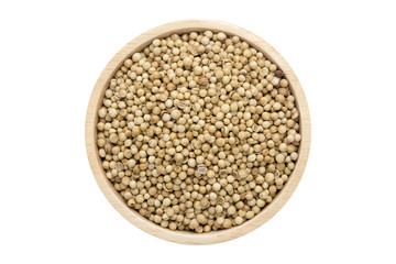 coriander seeds in wooden bowl isolated top view on white