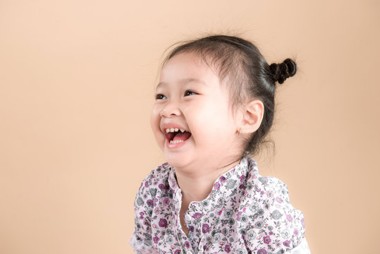 Beautiful Asian Baby Girl Smiling Happily