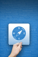 Compass symbol on blue typography background