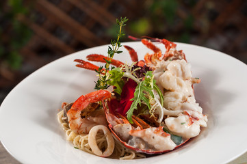 baked lobster with seafood and noodles