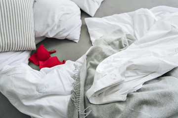 Male and female clothes on bed