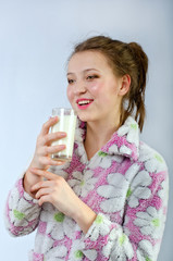 beautiful girl in pajamas with milk