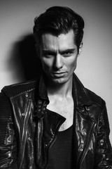 black and white portrait of  young man in leather jacket