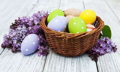 easter eggs and fresh lilac flowers