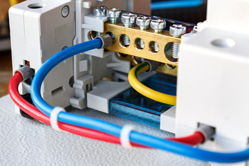 Connecting components of the electrical panel closeup
