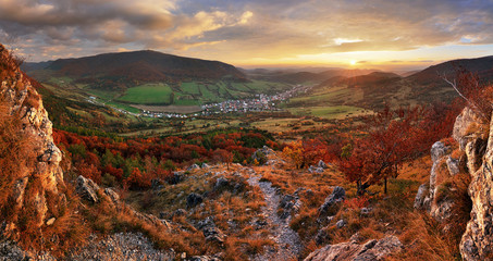 Panorama of Colorful autumn landscape in the mountain village. Foggy morning in the Carpathian mountains.