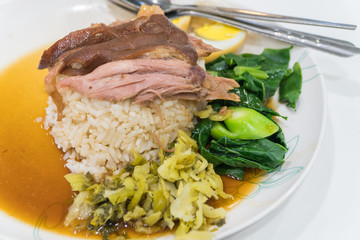 Stewed pork leg on rice with sauce.Thai food