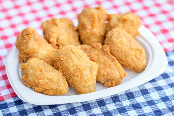 A plate of fresh, hot, crispy fried chicken