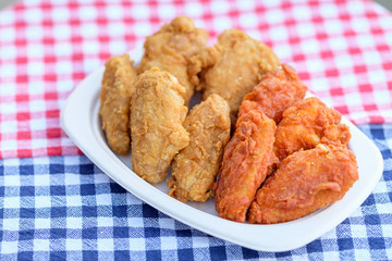 A plate of fresh, hot, crispy fried chicken