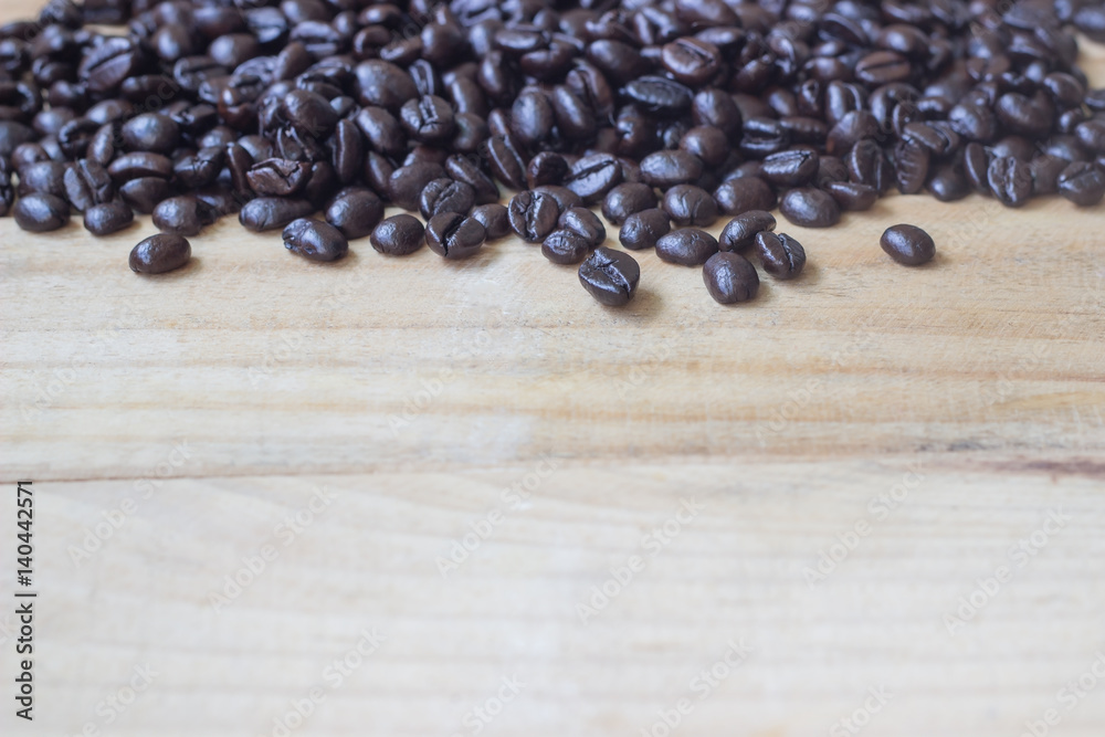 Wall mural coffee beans on wood