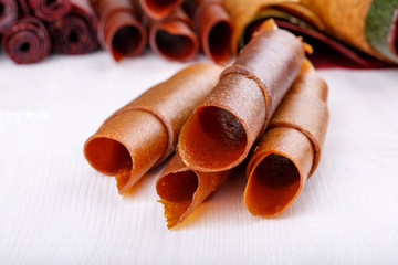 Apple fruit leather rolls. Fruit candy - pastille.