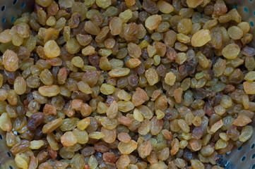 Brown raisins background closeup