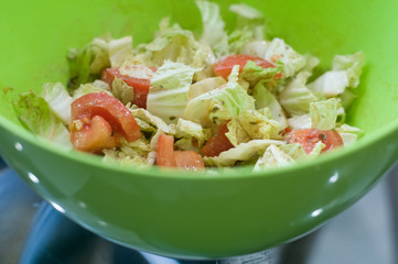Greek salad in green bowl