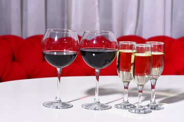 White and red wine served in different glasses