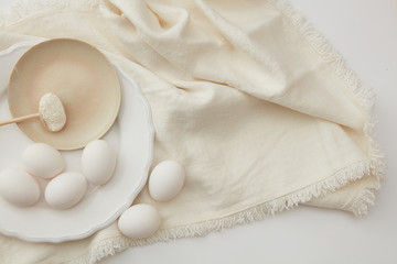 Fototapeta na wymiar Raw eggs and spoon of flour