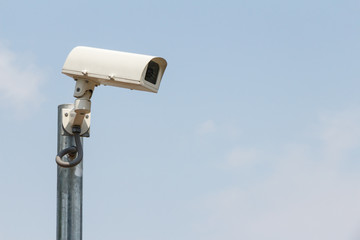 Security cameras or CCTV against sky