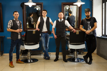 Male team of barbers at modern barbershop