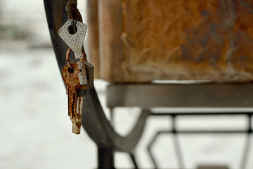 Lost and found keys on a ring on an outdoor barbecue grill handle 