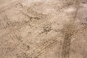 Tire tracks on a wet muddy road