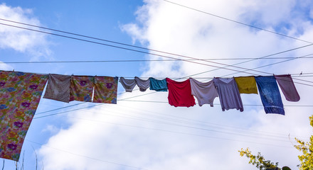 Underwear drying on the rope between old houses