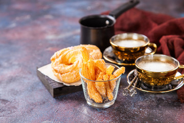 Eclairs and coffee on a table. Selective focus. Copy space