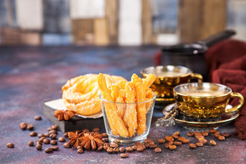 Eclairs and coffee on a table. Selective focus. Copy space