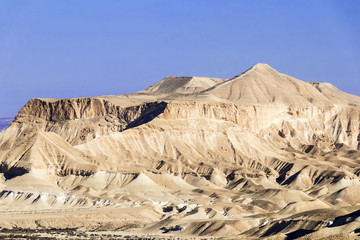 White sand mountains in desert, blue sky