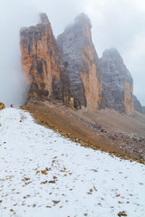 Tre Cime di Lavaredo in beautiful surroundings in the Dolomites at foggy weather   (Drei Zinnen)