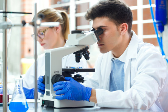Young scientists carrying out an experiment in a laboratory.