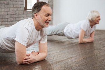 Positive delighted male person while training