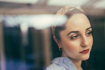 Portrait of exhausted young woman looking away