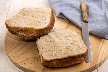 sliced breakfast bap on a wooden board