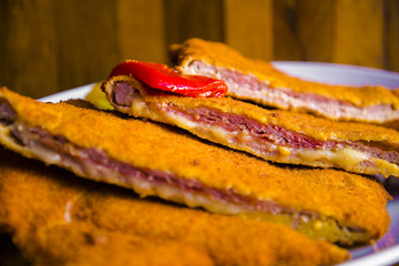Delicious typical breaded and filled veal meat - Asturian cachopo