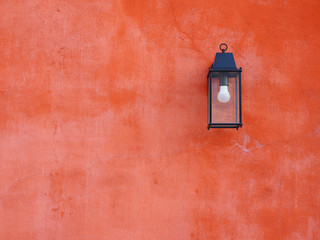 Orange wall with lamp