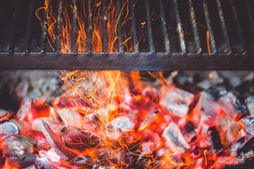Burning coals in the grill close up view